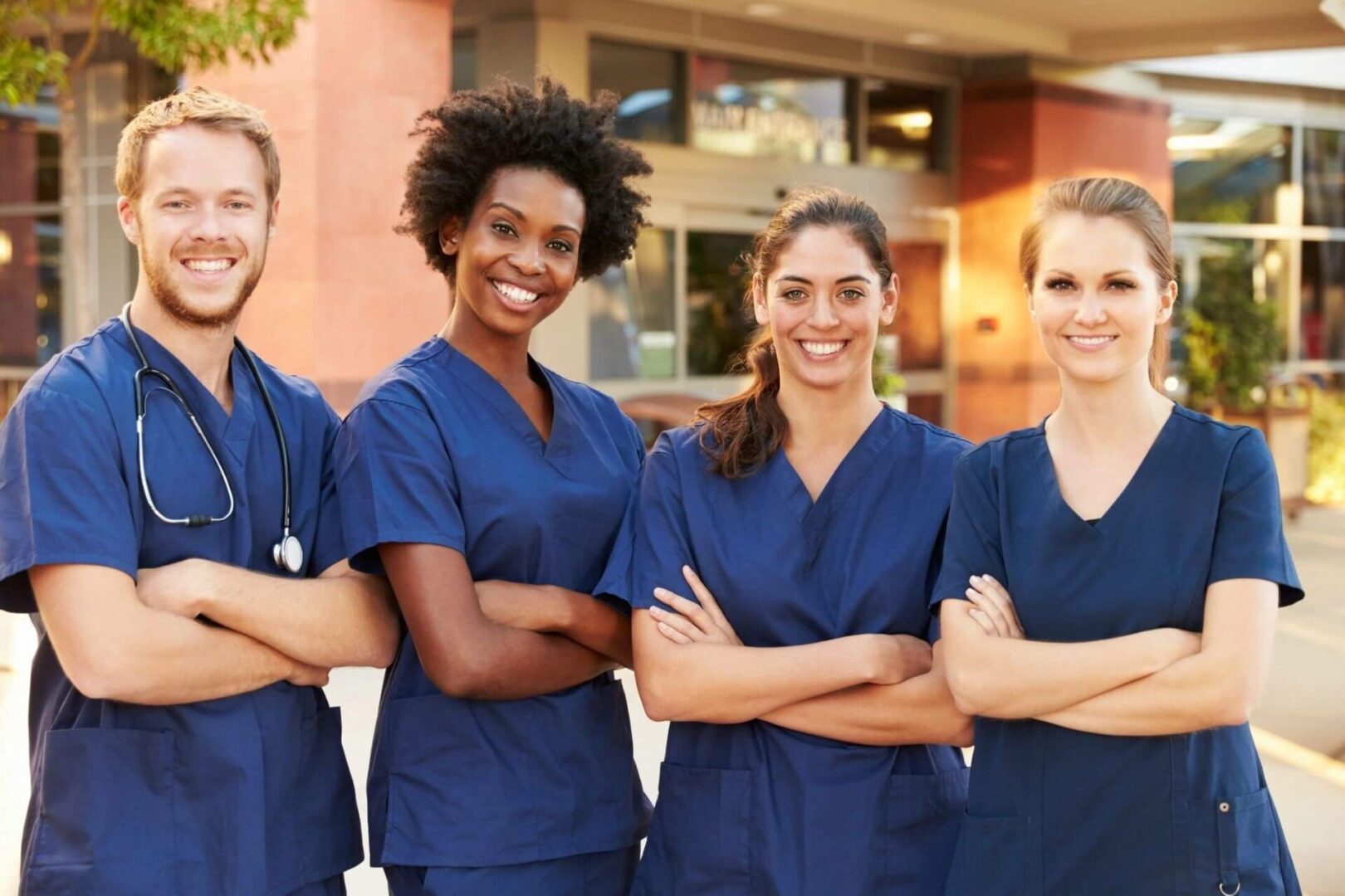 A group of nurses standing next to each other.